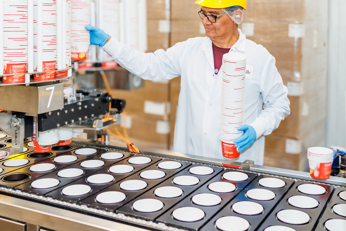 Man Packing On Assembly Line